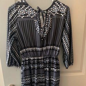 Never worn before romper with sleeves